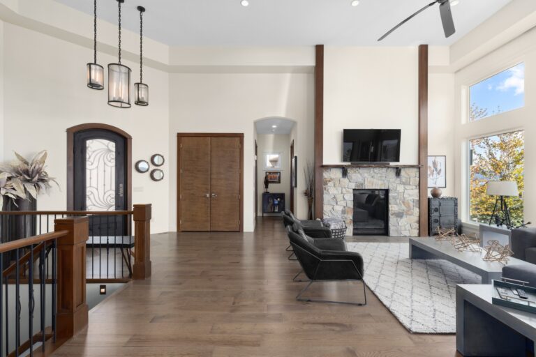 Great room with a fireplace seen from the entry, Kelowna home interior