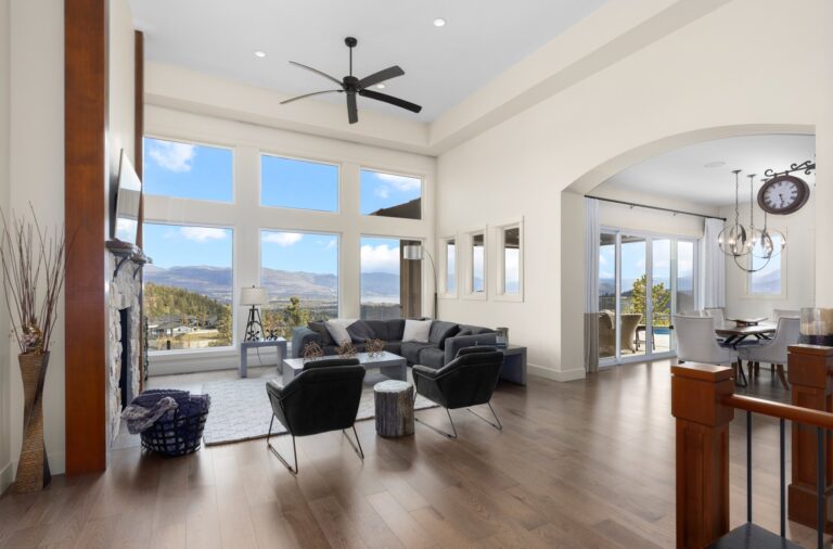 Vaulted living room with tall windows facing the valley, Kelowna home interior